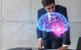 a man in a suit diligently working on a laptop with a brain displayed on its screen